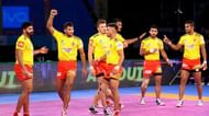 Sachin Tanwar has his arm raised after picking a point